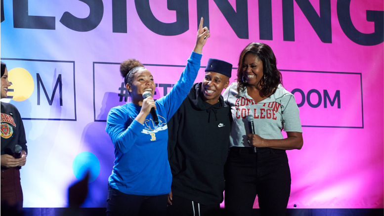 Girl pointing up and a man and Michelle Obama looking at her